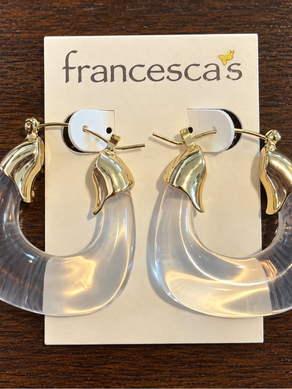 Francesca’s Clear Acrylic Hoop Earrings with Gold-Tone Accents
